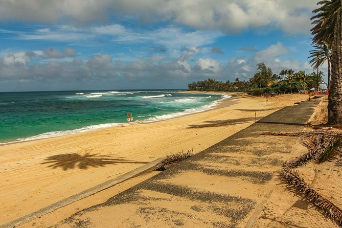 Best of Oahu: Pearl Harbor & Oahu Circle Island Tour from Waikiki - Downtown Honolulu drive-by: Kamehameha Statue and Iolani Palace